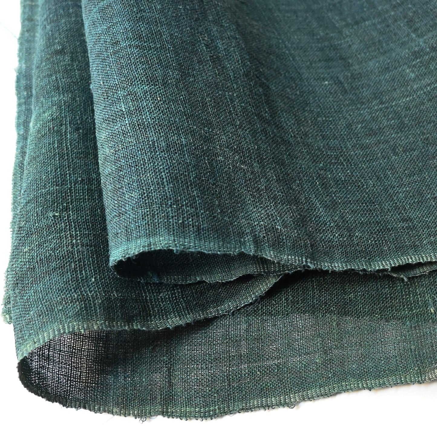 Close-up view of antique indigo green mosquito net kaya hemp panel.