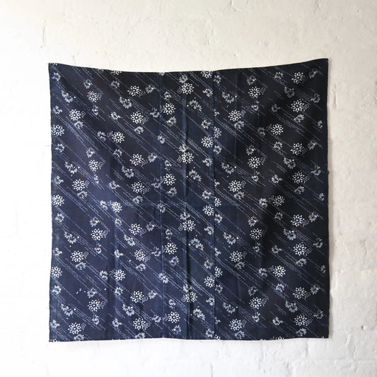 Full view of antique Japanese indigo katazome dyed cotton furoshiki, intricate dots and floral motifs.