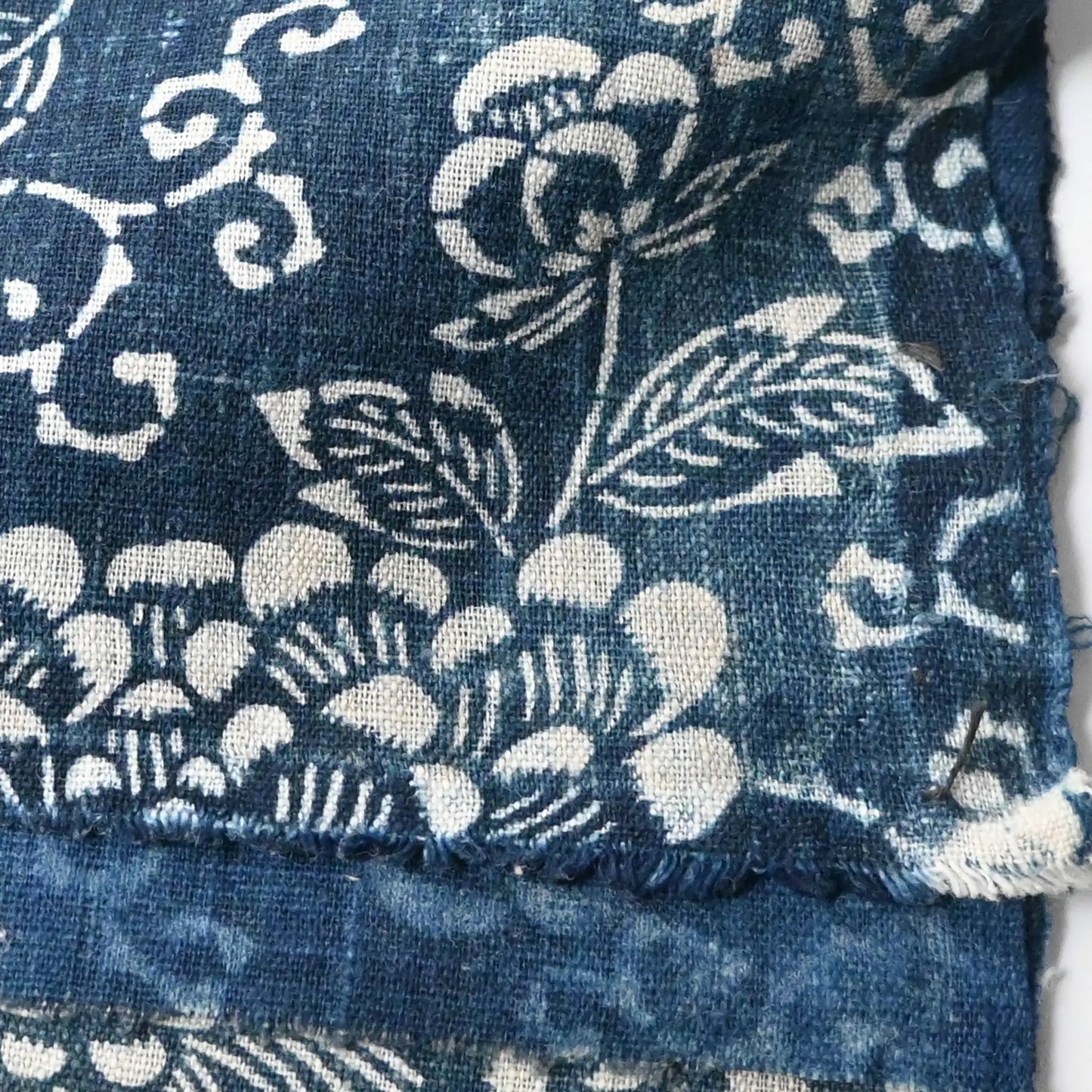 Detailed view of antique Japanese indigo Katazome cotton chrysanthemum arabesque from the early 20th century.