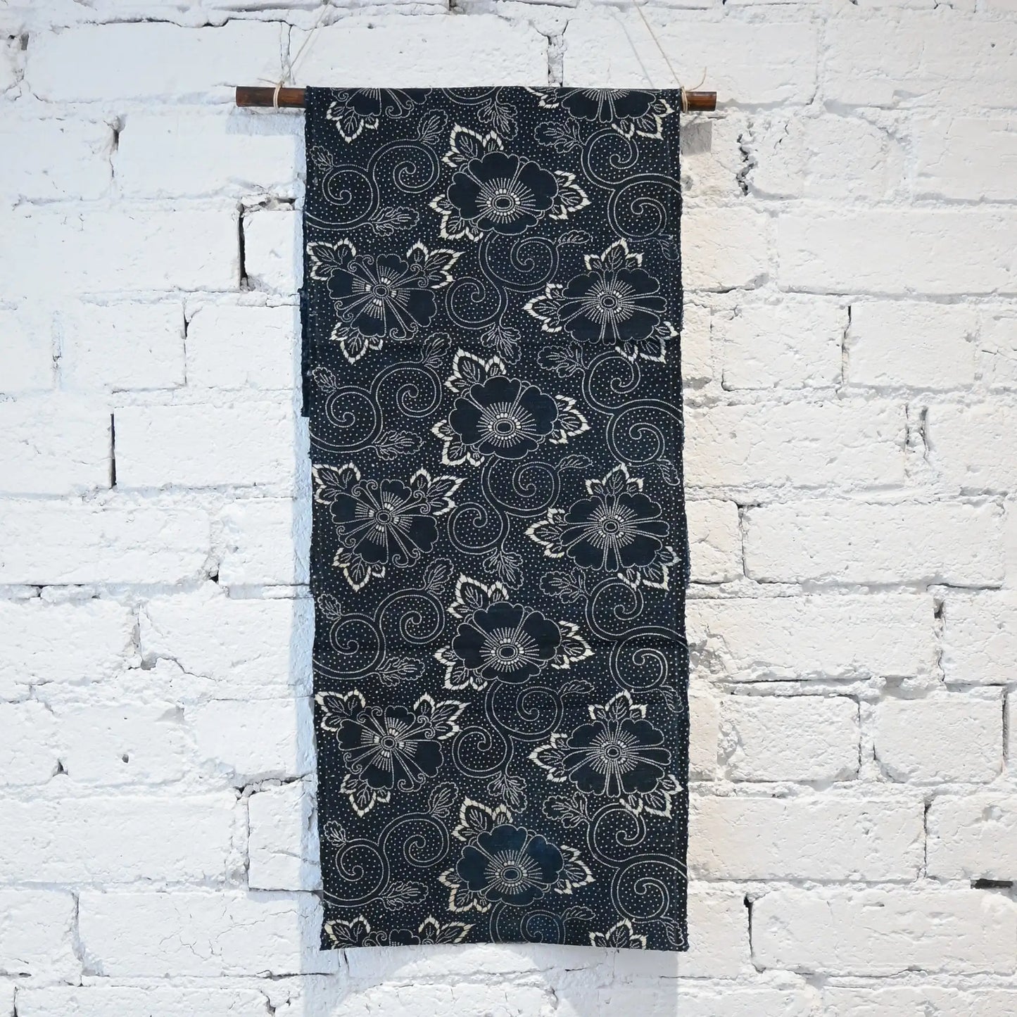 Full view of antique Japanese indigo Katazome cotton from the early 20th century, peony arabesque motif.
