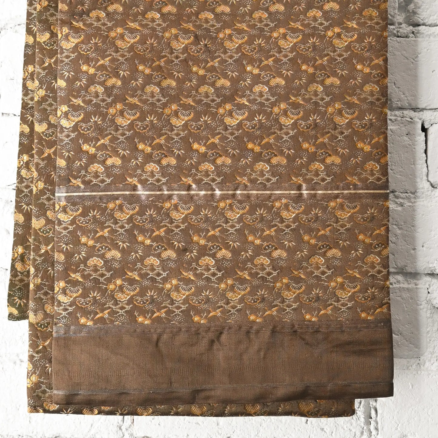 Detailed view of antique Japanese silk brocade Maru Obi, showing 'taresaki'
