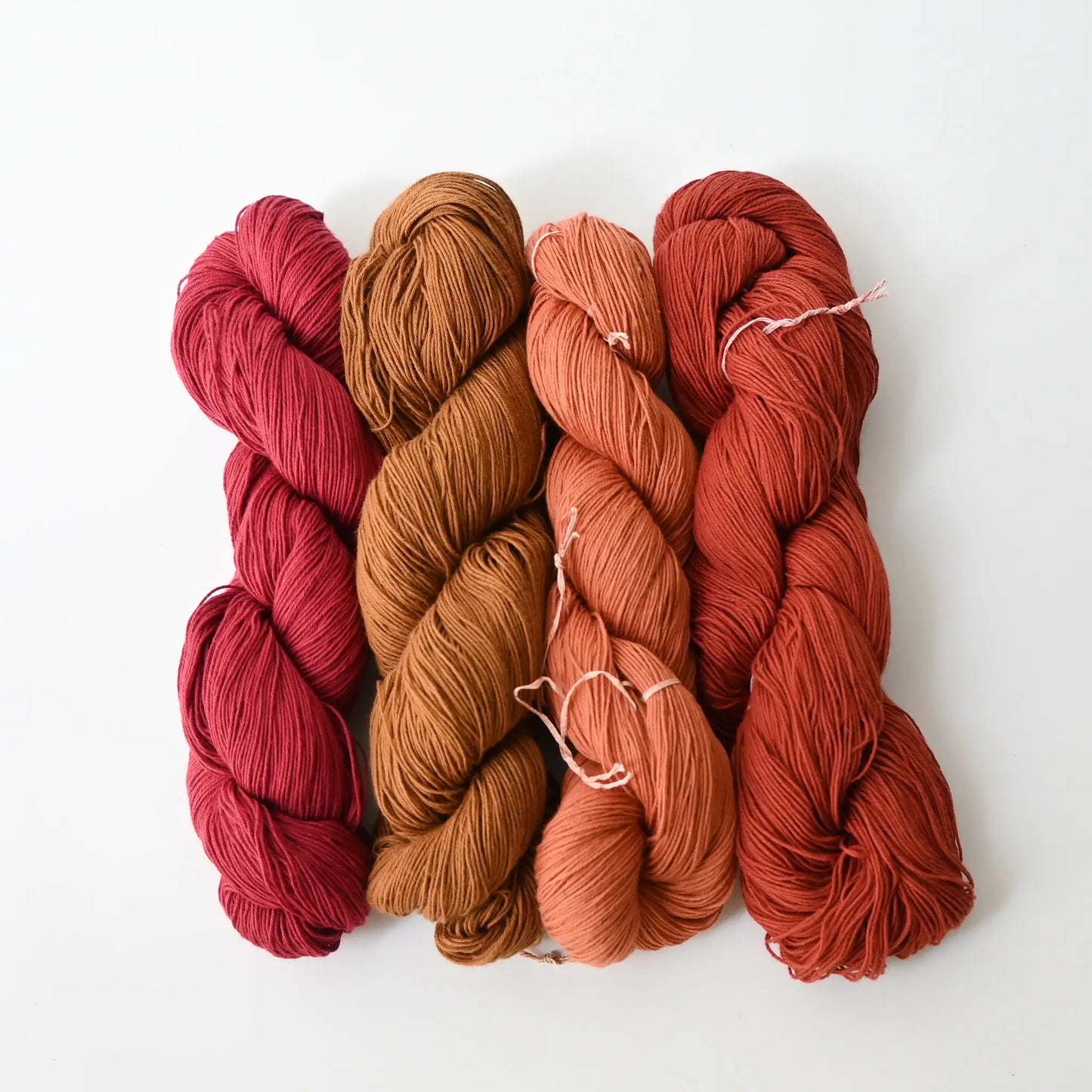 Authentic Japanese sashiko threads hanks from Hida, Gifu, in red tones.