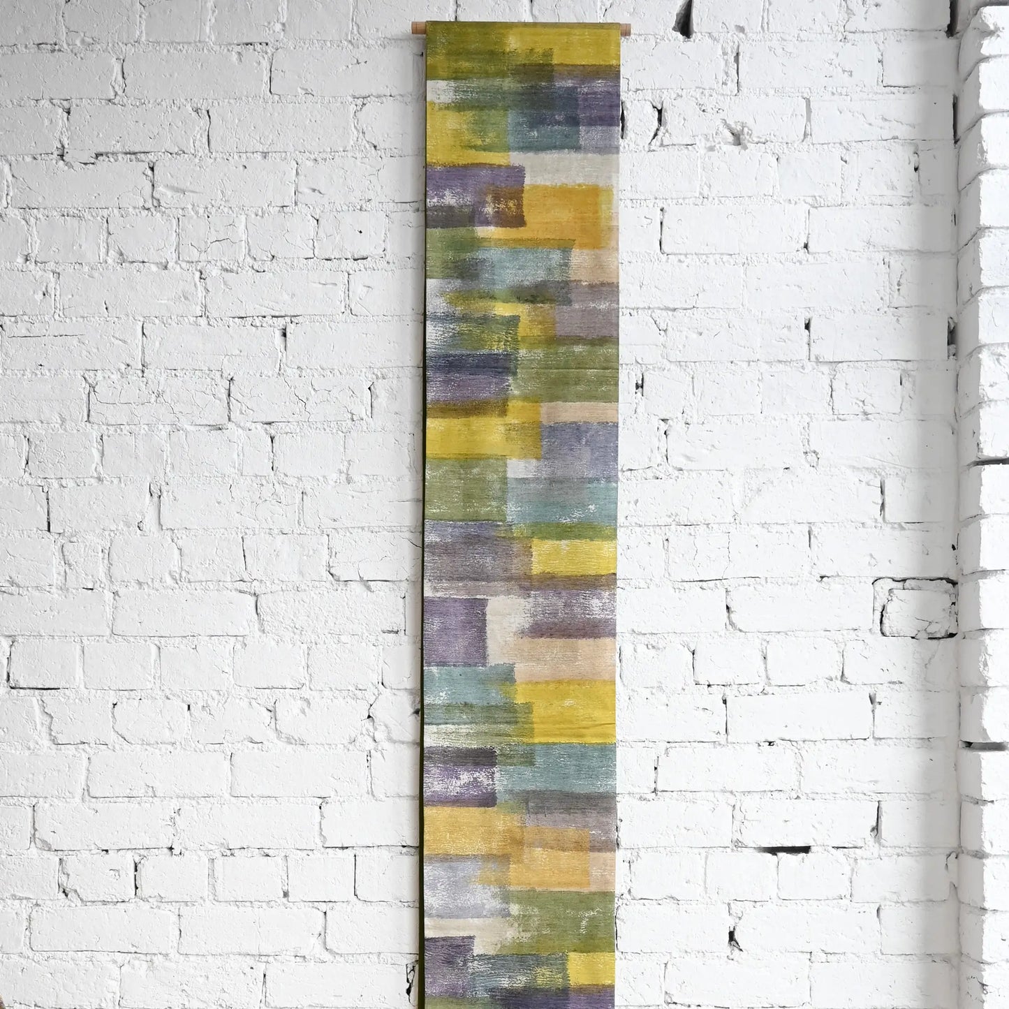 Hanging view of recycled women's tsumugi silk obi with dyed abstract painterly motif.