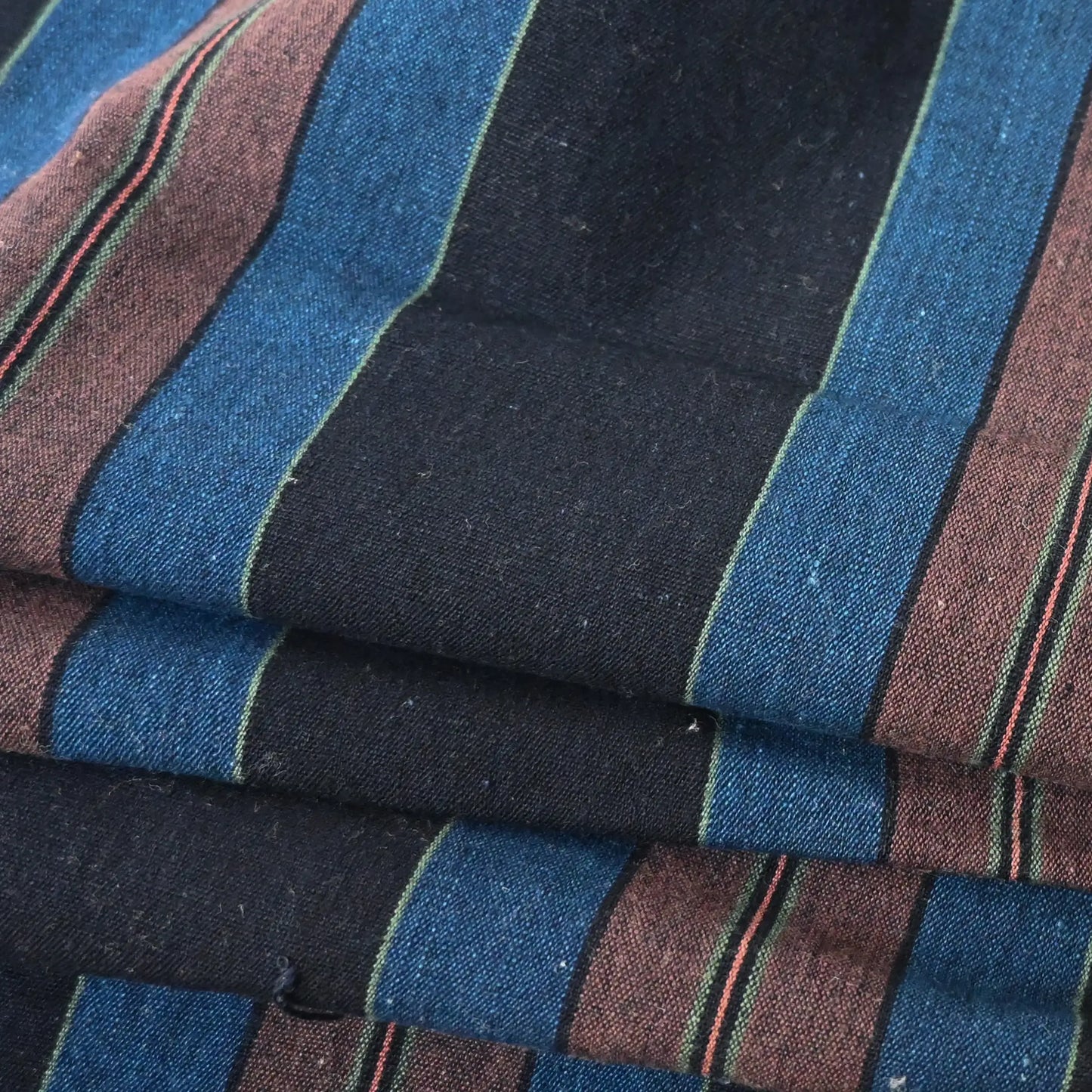 Close-up view of vintage Japanese indigo stripe cotton piece from a futon cover.