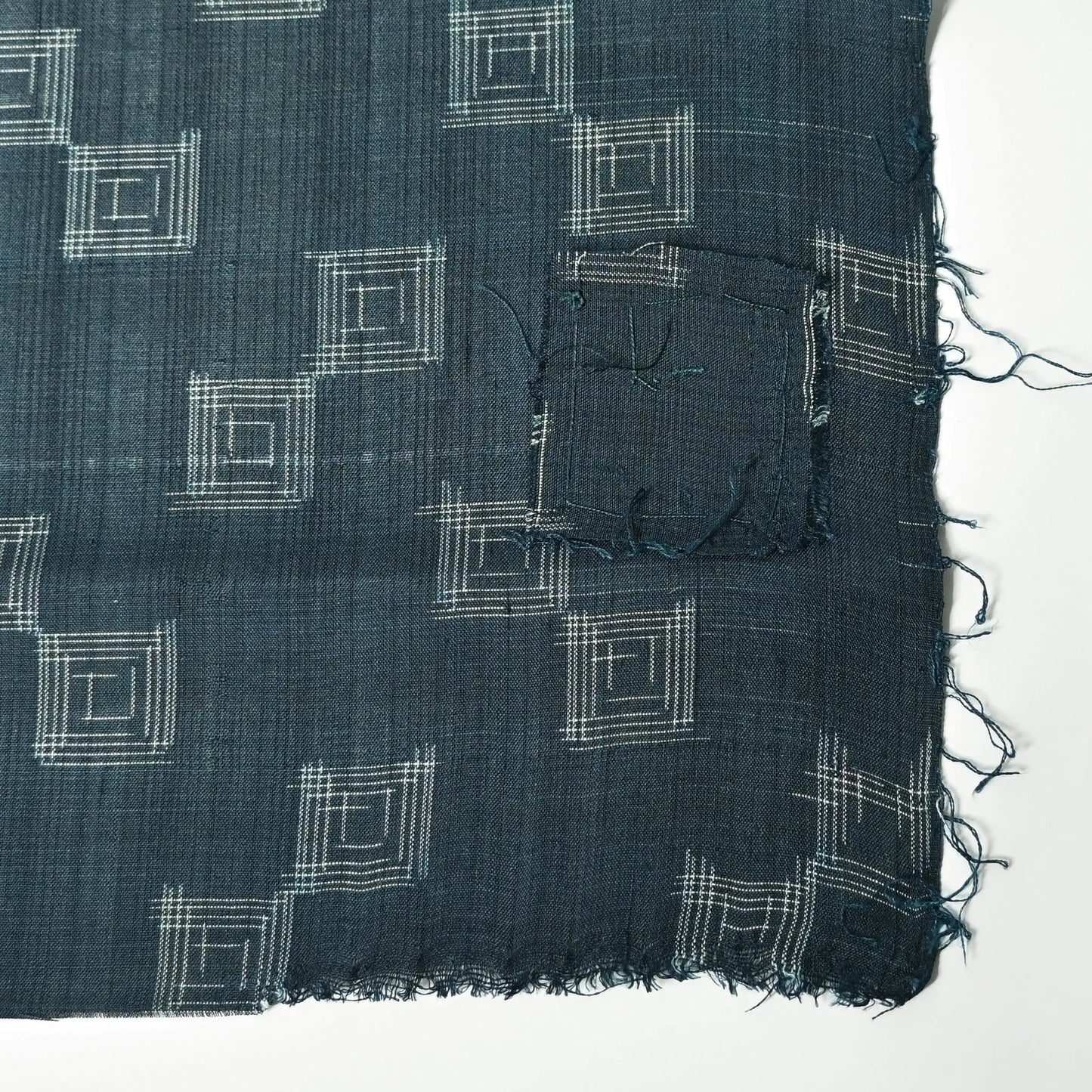 Vintage fine silk kimono fabric piece in dark emerald green with simple square pattern has a charming patch.