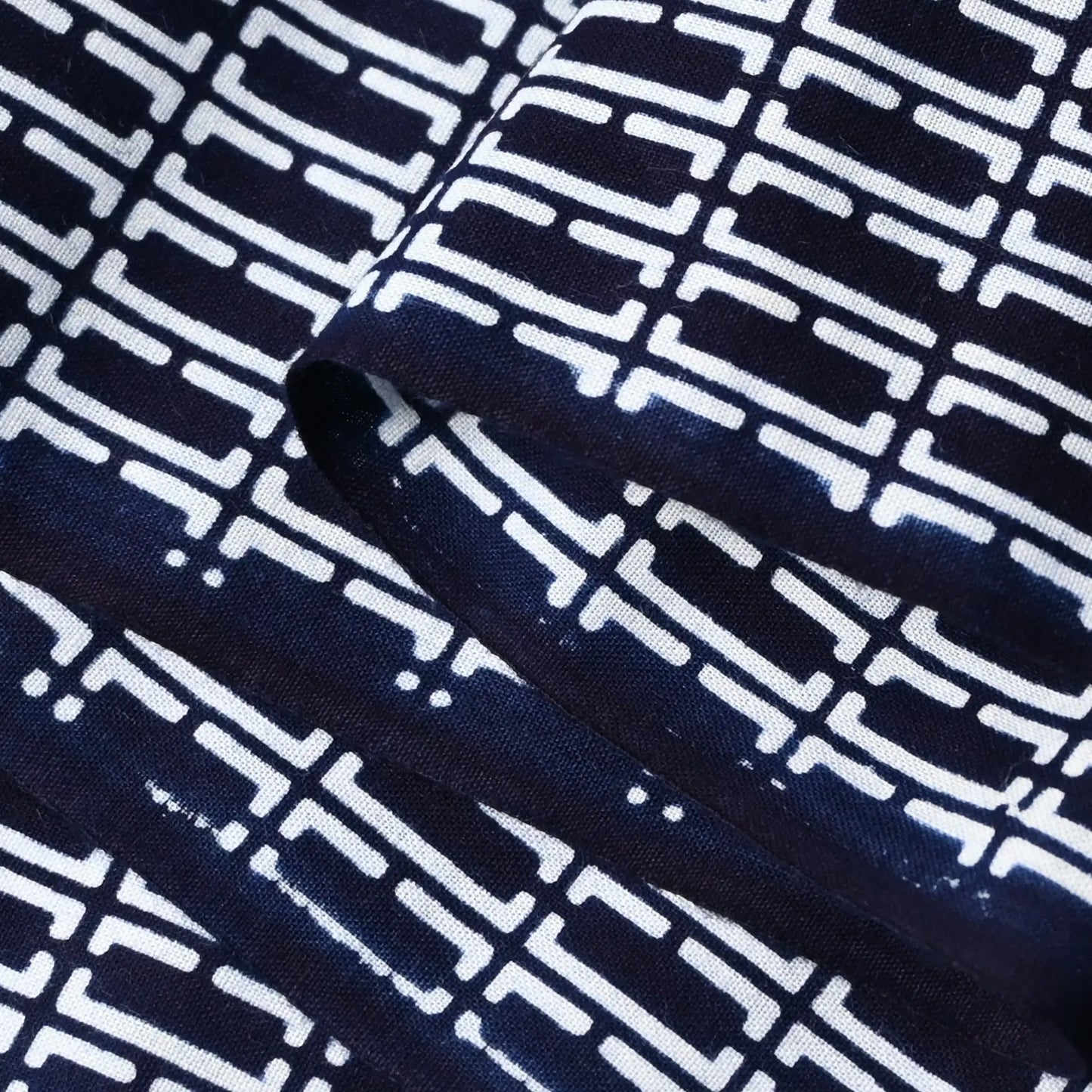 Close-up view of vintage traditional Japanese men's yukata cotton fabric sold by the metre.