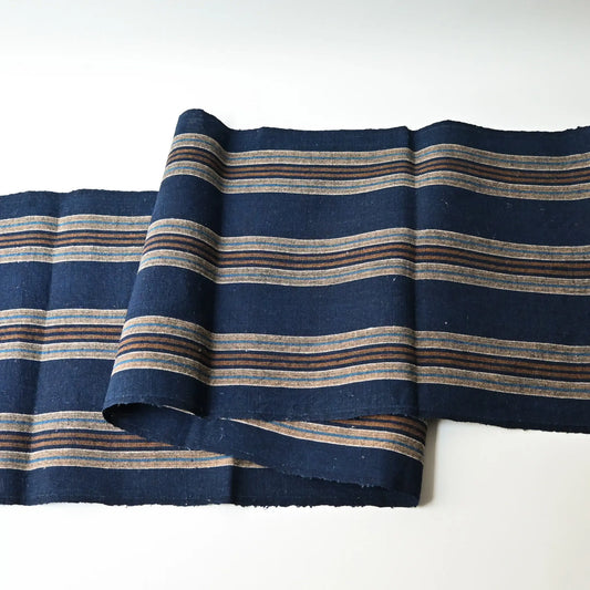 Full view of vintage Japanese indigo and warm brown stripe cotton piece from a futon cover, early 20th Century.