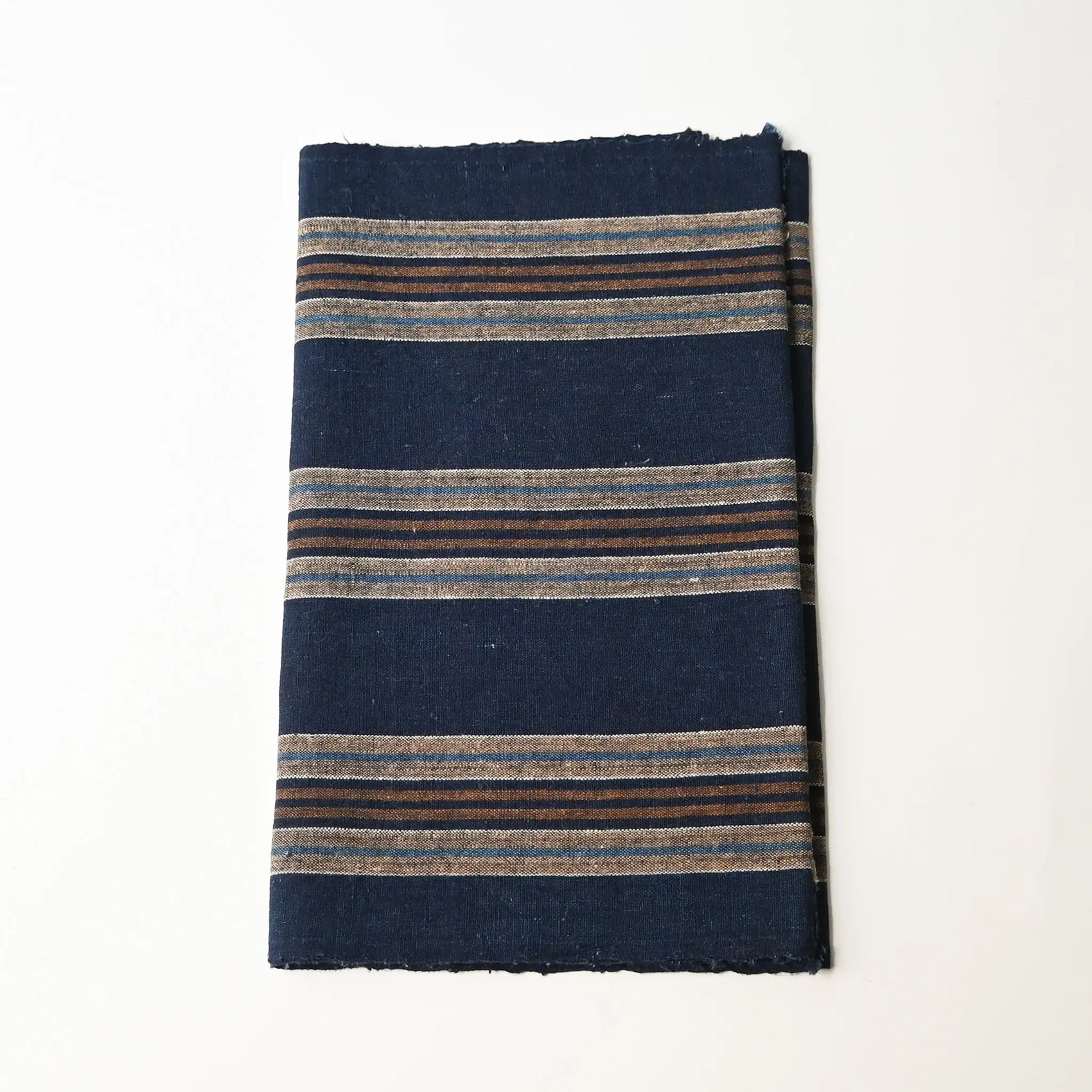Vintage Japanese indigo and warm brown stripe cotton piece from a futon cover, early 20th Century.