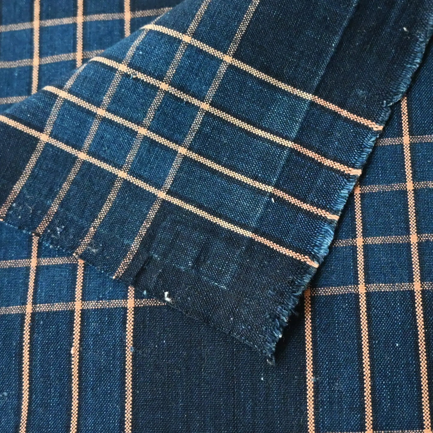 Close-up view of vintage Japanese indigo check cotton from a futon cover.