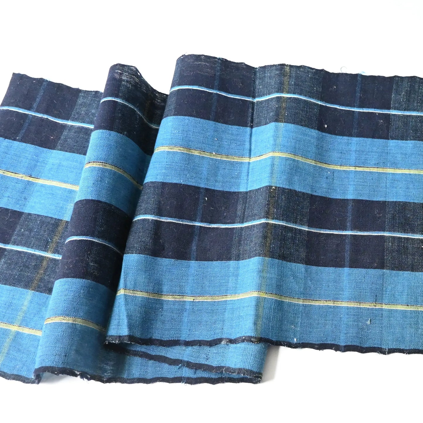 Full view of vintage Japanese hand loomed indigo check cotton piece, striking yet elegant pattern.