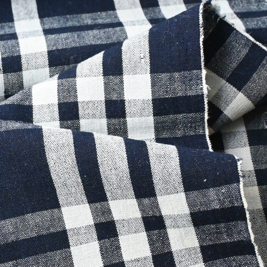 Detailed view of vintage Japanese indigo check cotton, a futon cover panel from the 20th century.