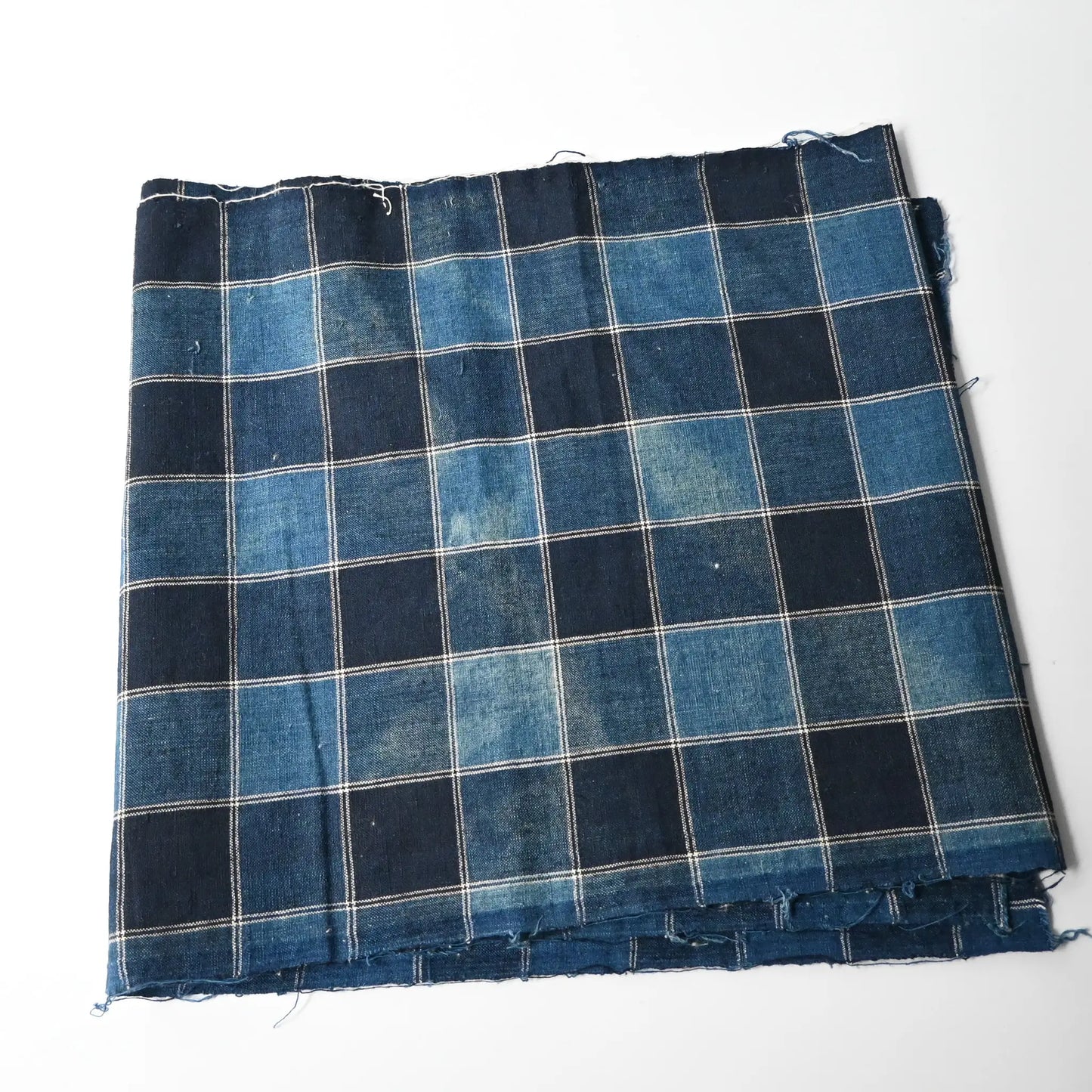 Faded part of vintage indigo check cotton futon cover panel.