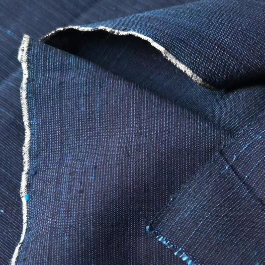 Close-up view of vintage fine stripe indigo cotton piece from undone kimono.