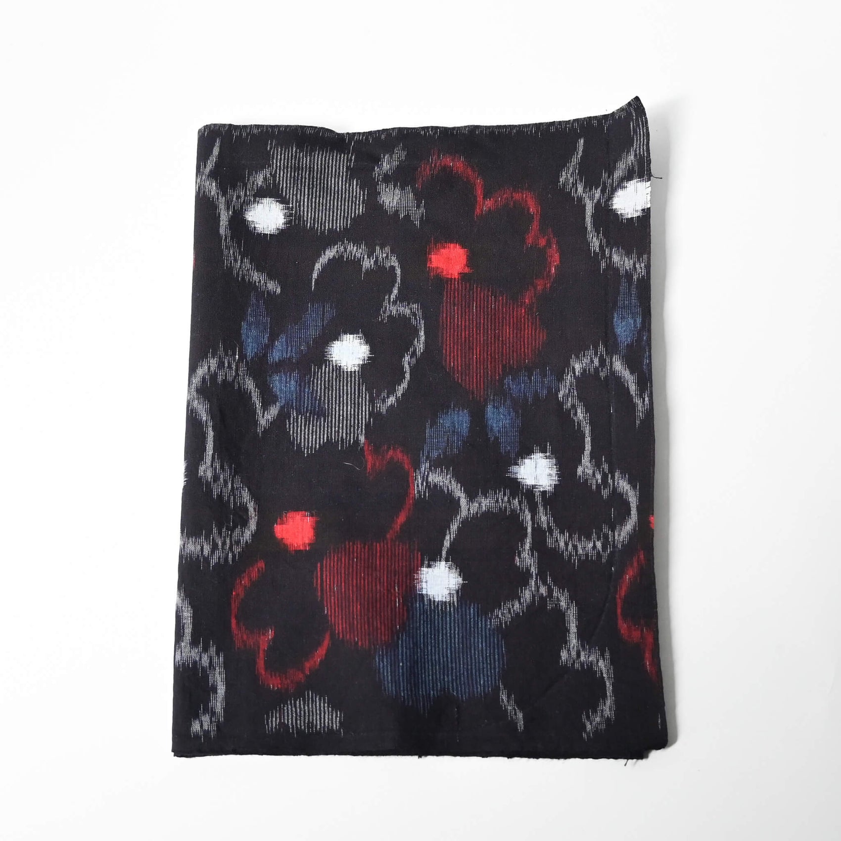 Vintage indigo kasuri cotton kimono fabric with bold floral pattern in red and blue.