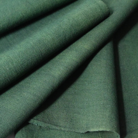 close-up view of vintage Japanese dead stock indigo green futon cover fabric bolt from early to mid 20th C, sold by the metre.