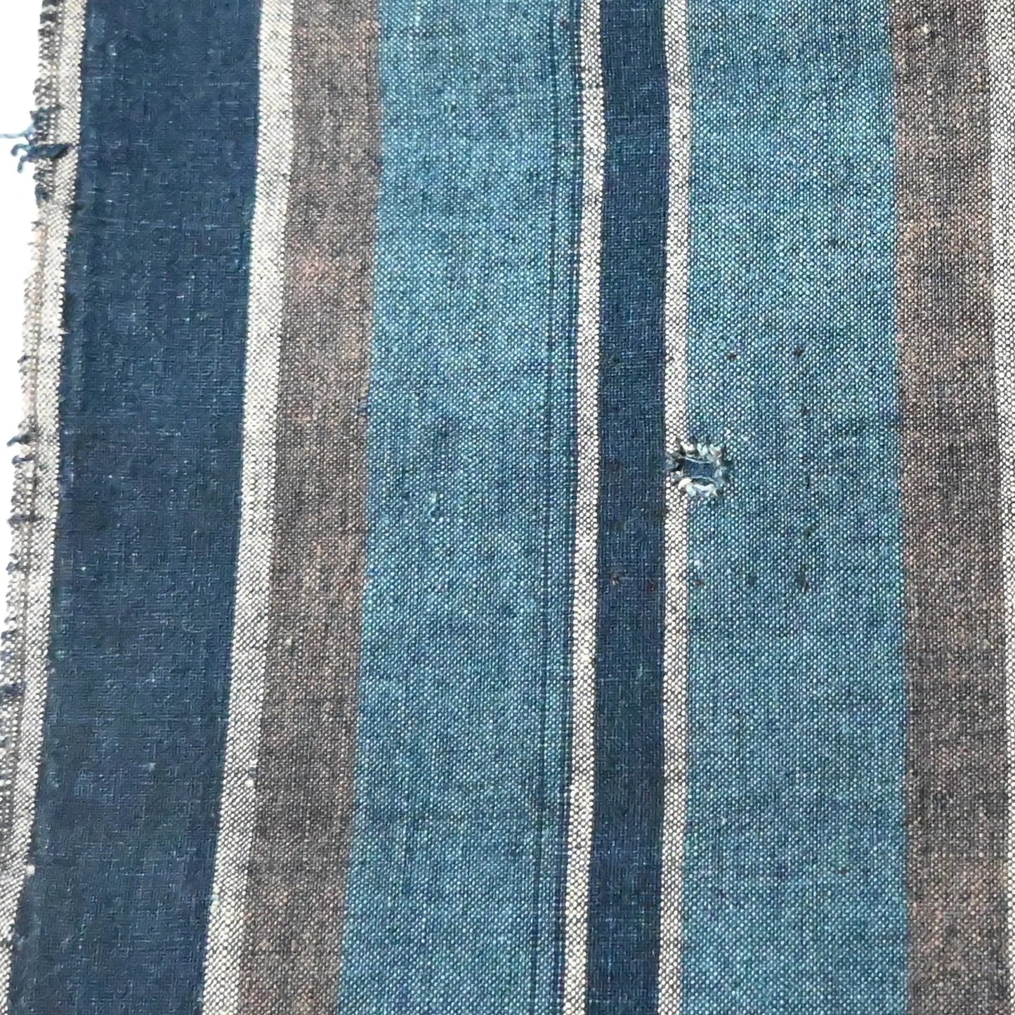 A mended patch of vintage Japanese indigo stripe cotton futon cover panel.