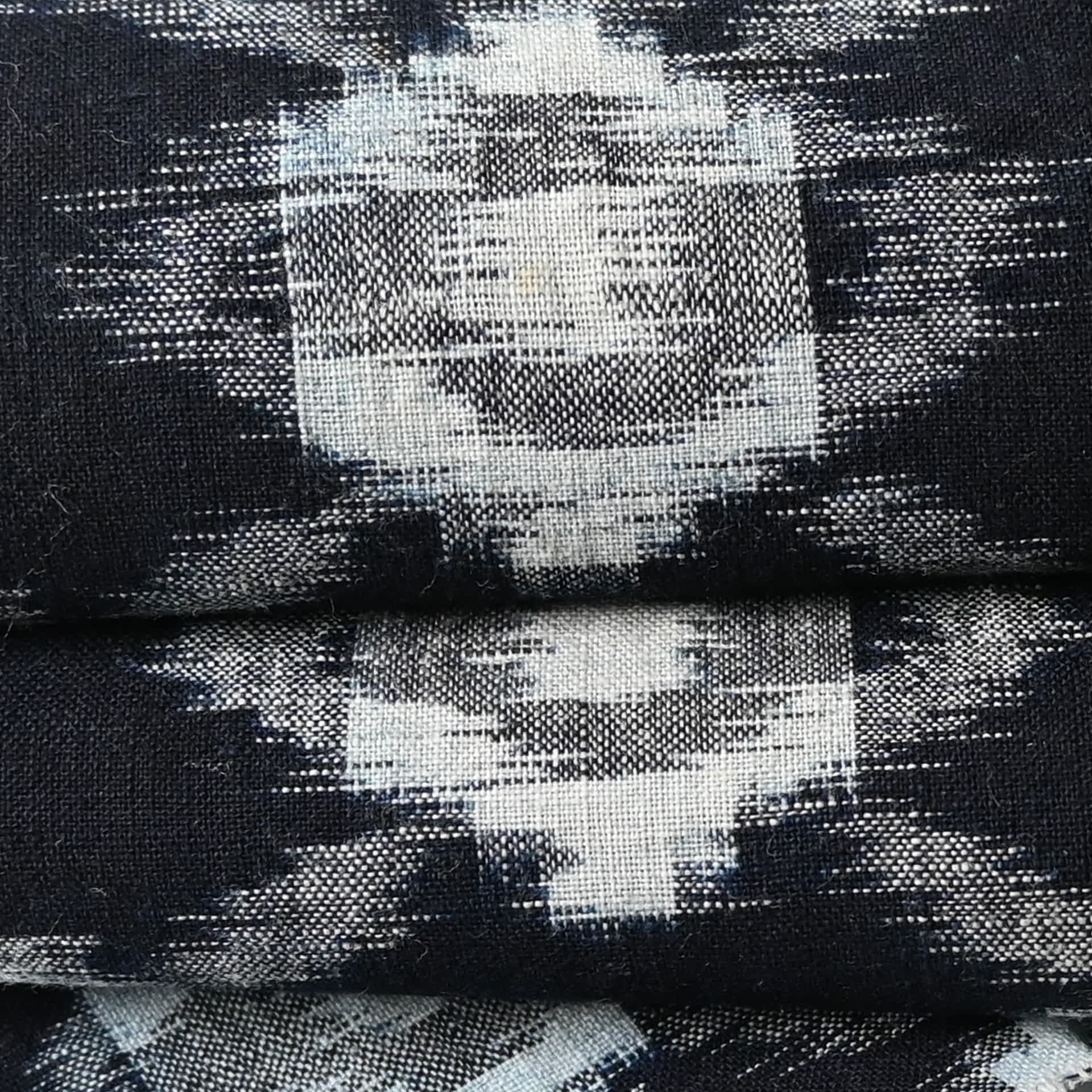 Close up view of vintage Japanese indigo Kasuri cotton kimono piece, ikat woven pattern.