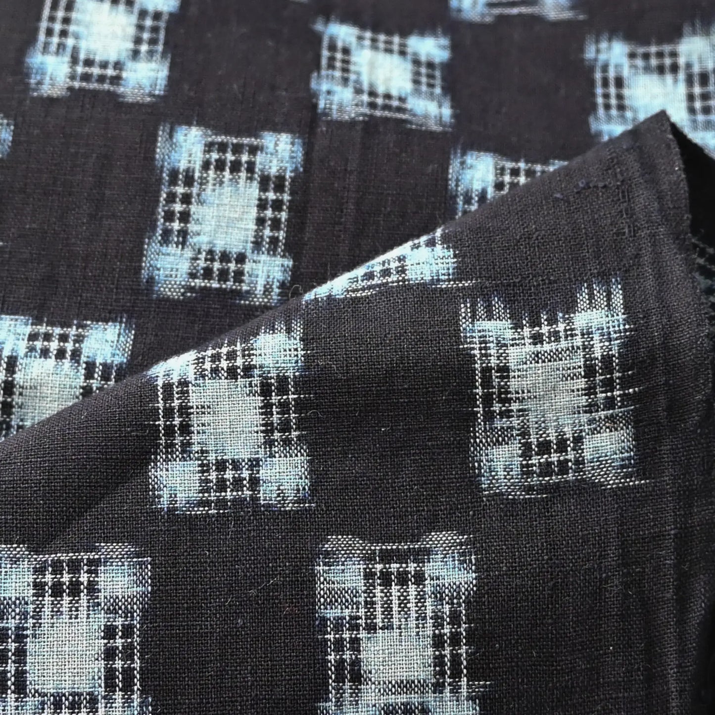 Detailed view of vintage Japanese indigo cotton piece with Igeta Kasuri pattern.