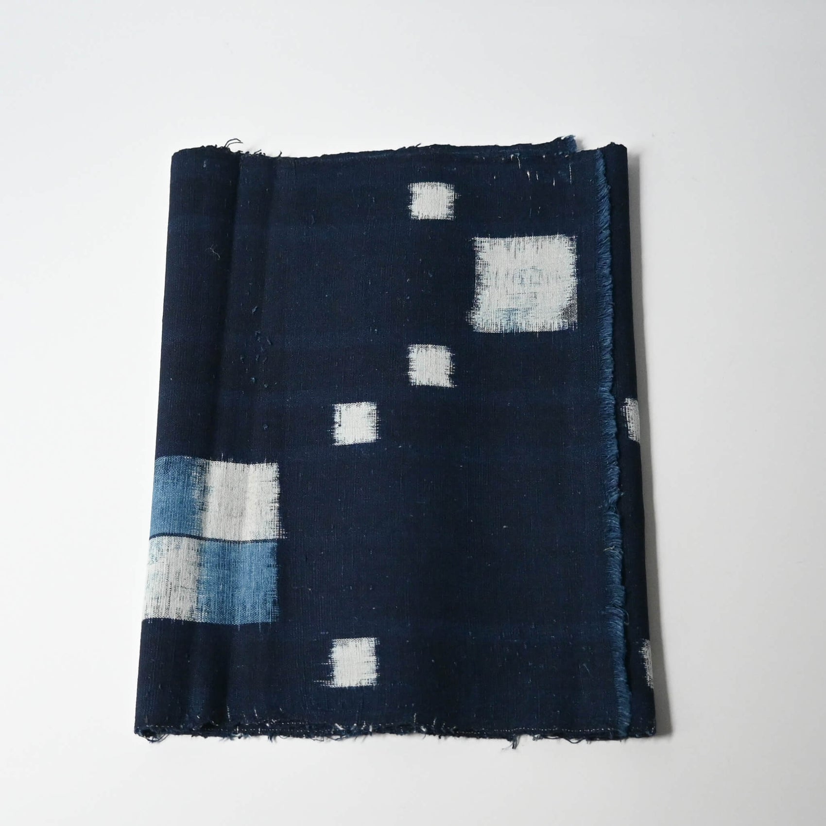 Vintage Japanese indigo kasuri cotton panel from San'in region, a simple geometric pattern.