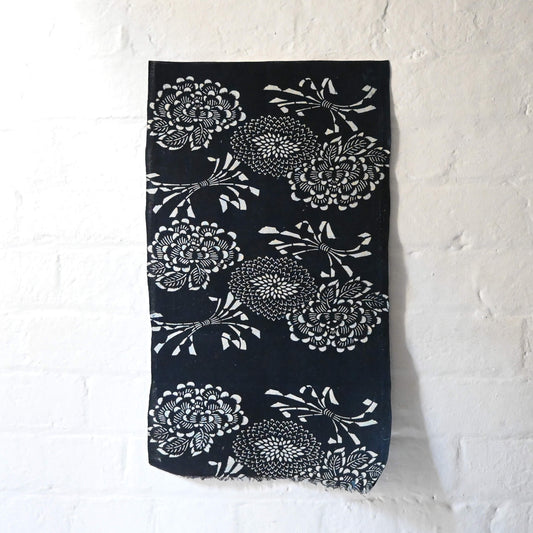 Full view of vintage indigo katazome cotton fragment with peony, chrysanthemum and noshi paper motifs.