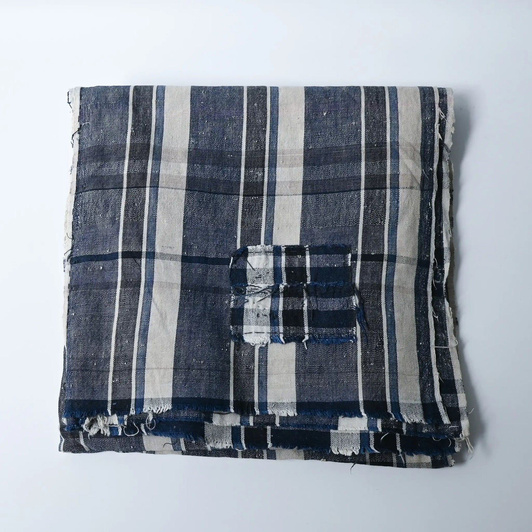 Vintage Japanese indigo plaid cotton futon cover with some small mended patches.