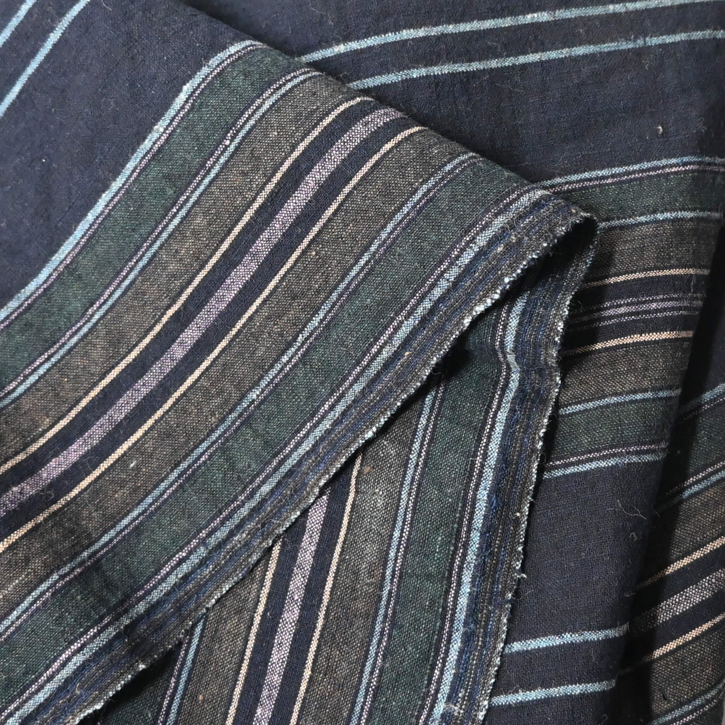 Close-up view of vintage Japanese indigo stripe cotton piece from a futon cover, mid-20th century.