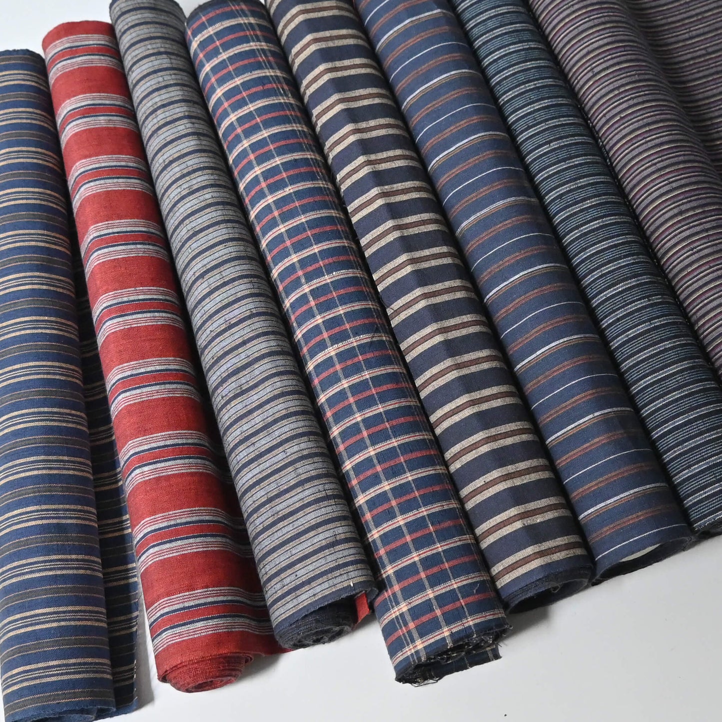 Set of five vintage Japanese cotton kimono fabric pieces in assorted checks and stripes.
