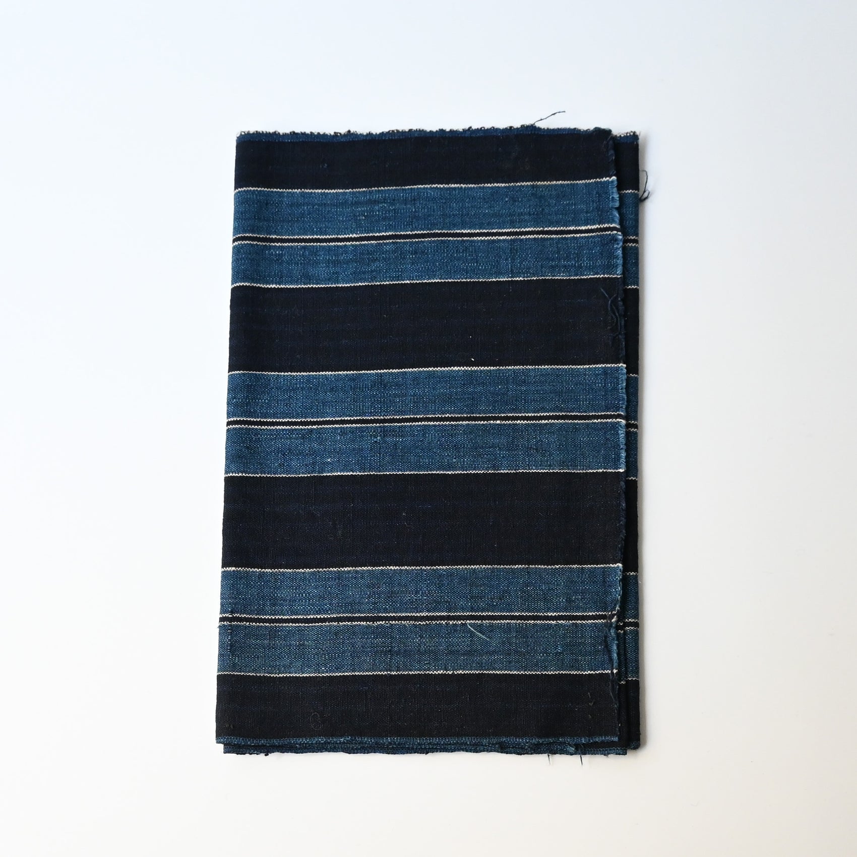 Vintage Japanese heavy weight indigo cotton with a bold stripe pattern.