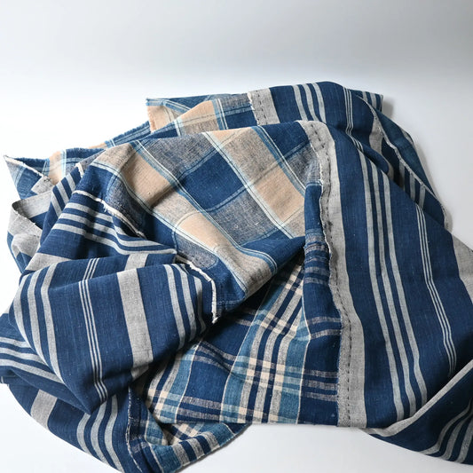 Vintage Japanese indigo futon cover with check and stripe from mid-20th century has a soft feel and drape.