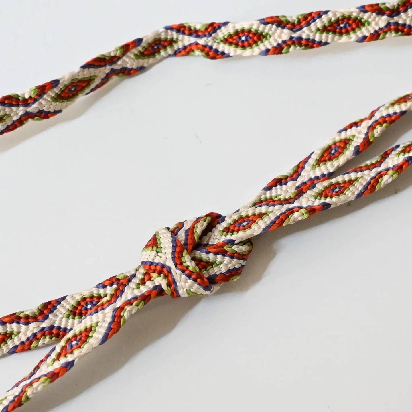 Vintage Japanese kumihimo braided silk Obijime, unique psychedelic design, tied in a knot.