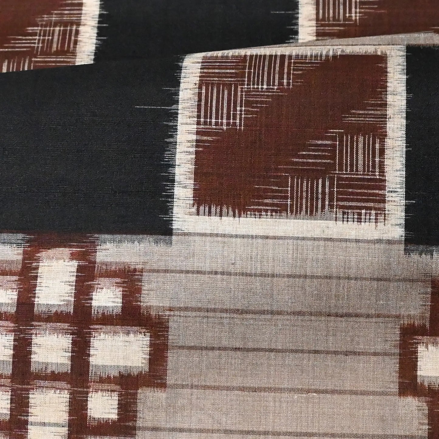 Detailed view of vintage Japanese silk kimono fabric with bold geometric pattern from the mid-20th century.