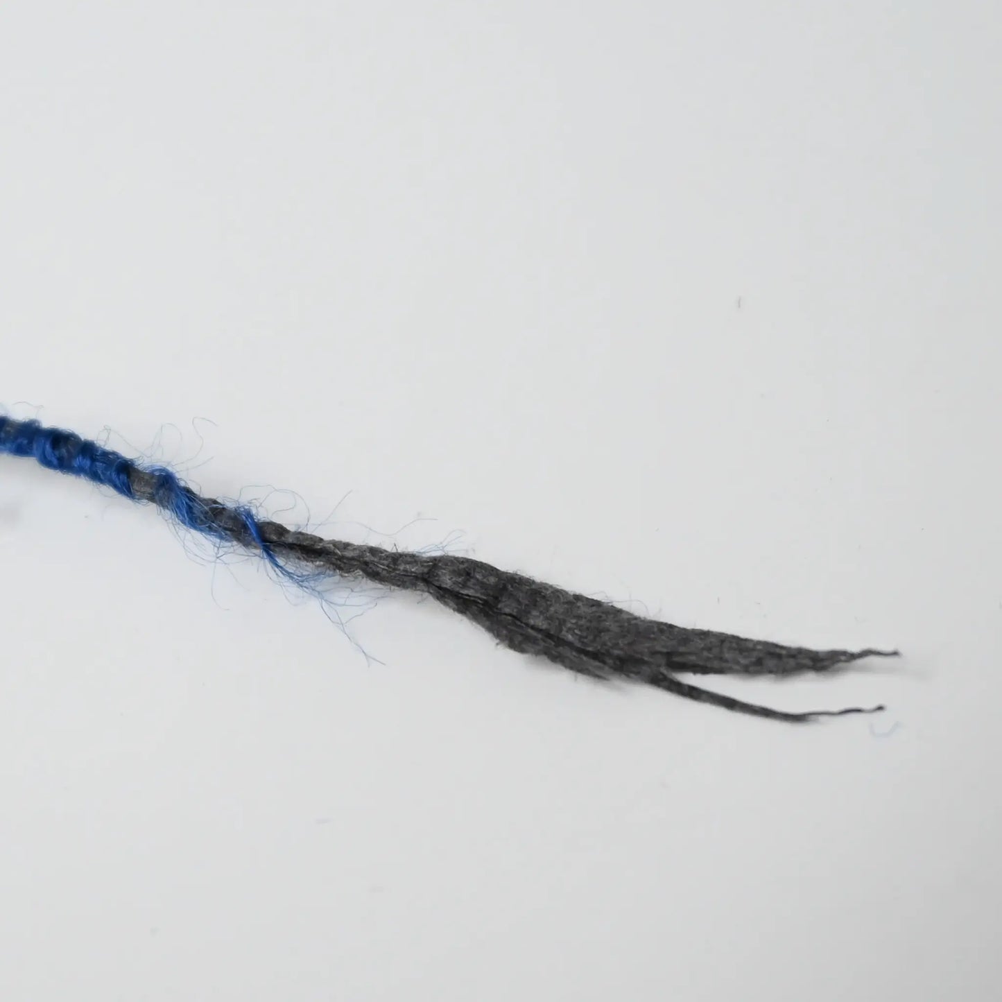 Detailed view of paper yarn of vintage blue and white striped obi.