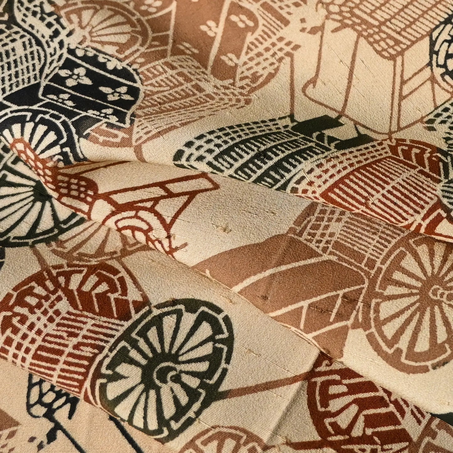 Detailed view of vintage silk kimono fabric piece with katazome stencil dyed court carriage motifs.