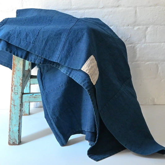 Vintage Japanese three-panel indigo dyed cotton throw with sashiko stitching.