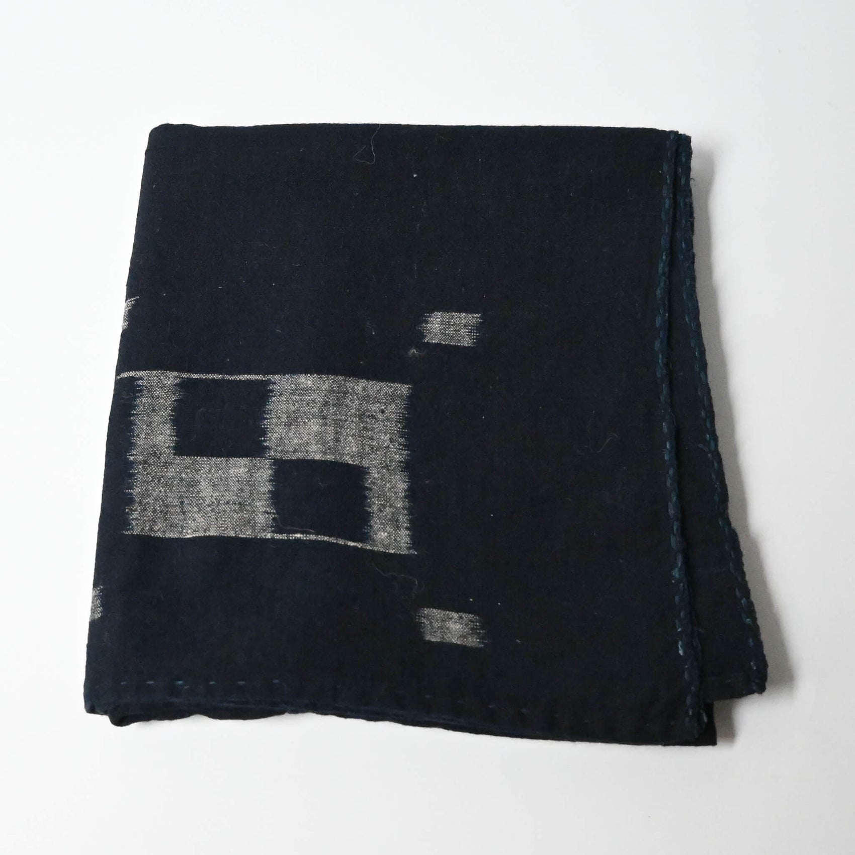 Vintage Japanese three-panel indigo kasuri cotton furoshiki with simple and understated design.