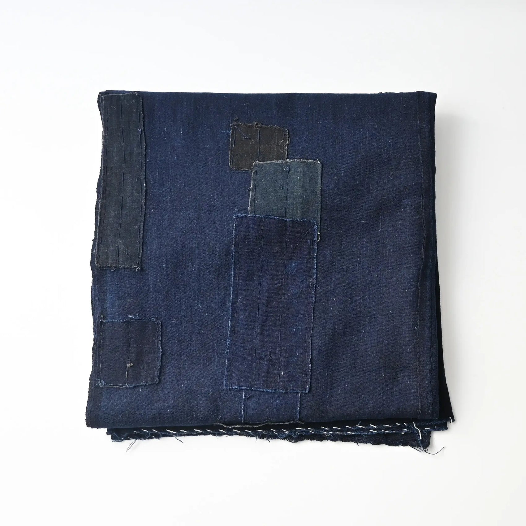Vintage Japanese three-panel plain indigo cotton futon cover with patches from the mid-20th century.