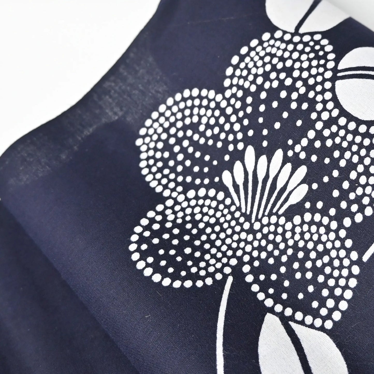 Close-up view of vintage traditional Japanese cotton yukata fabric with camellia pattern.