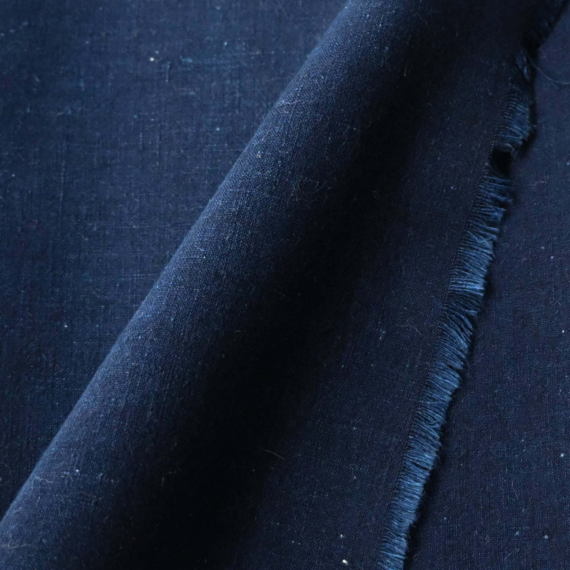 Close-up view of vintage Japanese plain indigo cotton piece, ideal for sashiko stitching.
