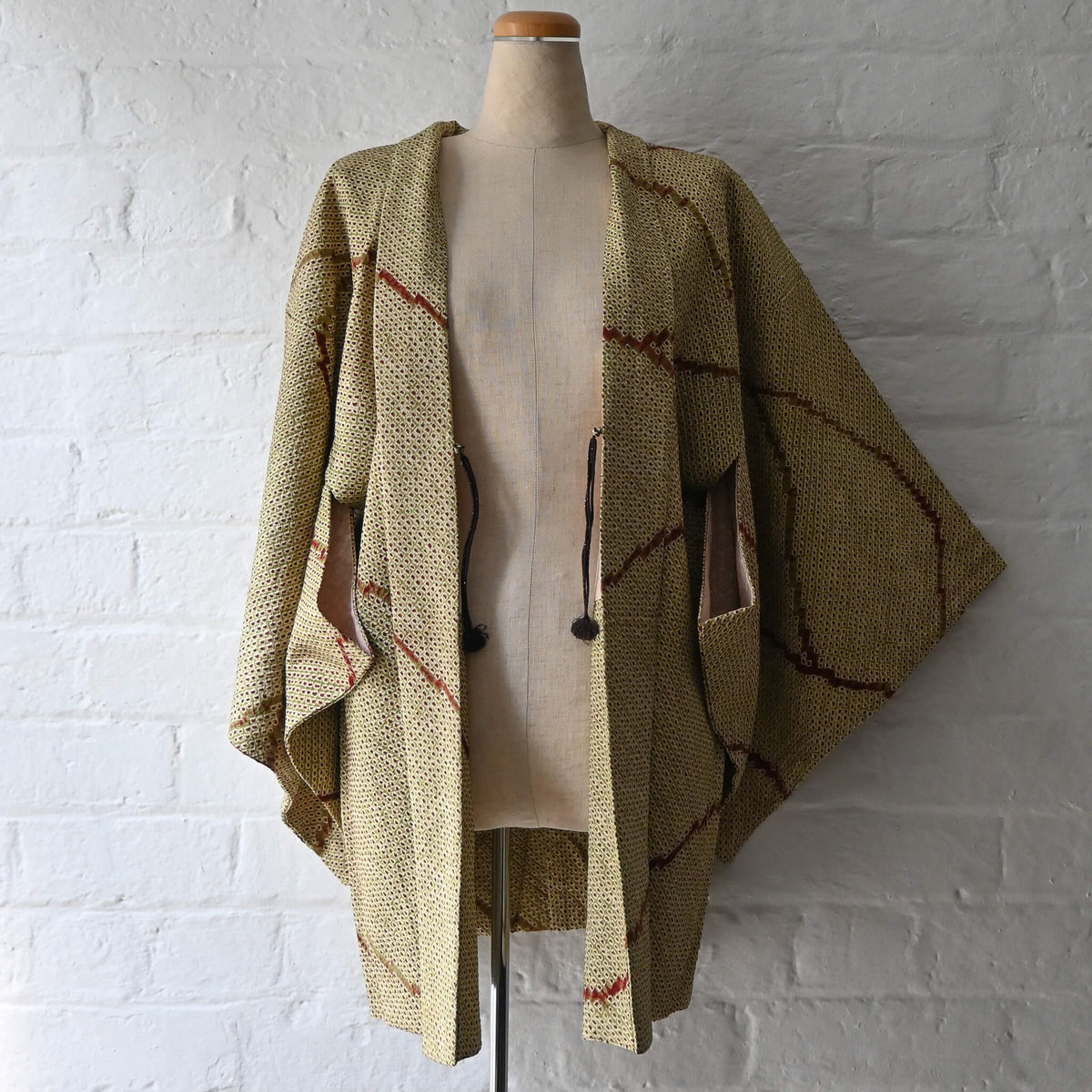 Vintage women's silk shibori haori with an olive green and reddish-brown all-over pattern.