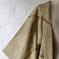 Vintage women's silk shibori haori with an olive green and reddish-brown all-over pattern.
