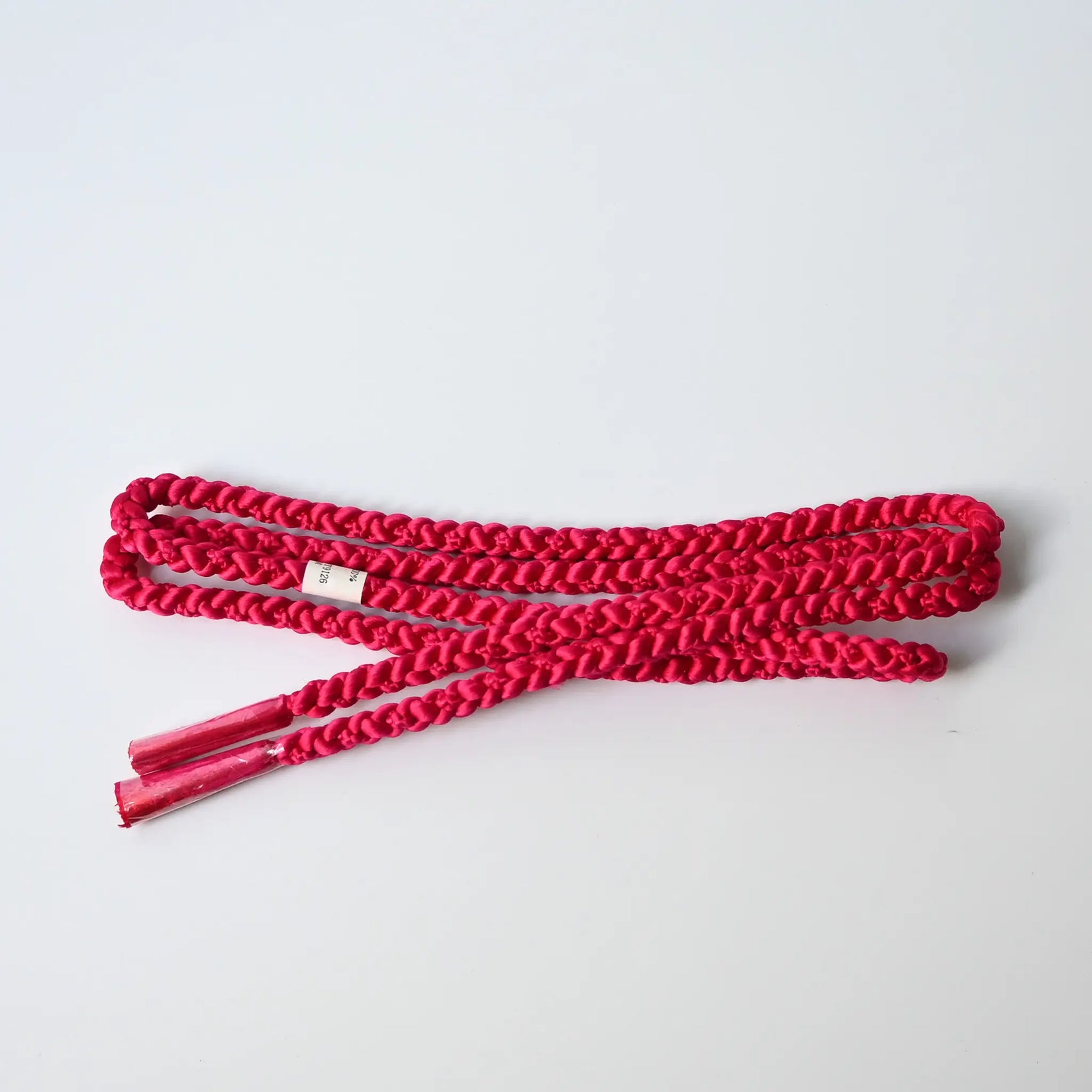 Recycled silk obijime braided cord in a striking dark hot pink.