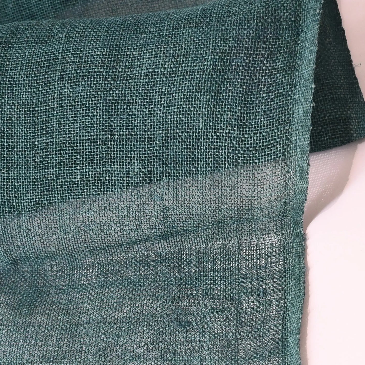 Close-up view of antique indigo green open weave hemp in indigo green, originally from a mosquito net Kaya.