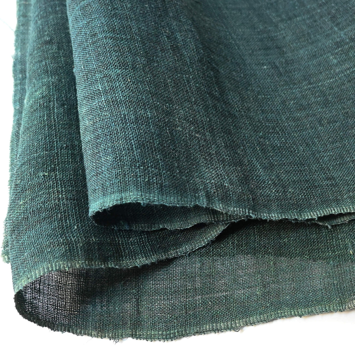 Close-up view of antique indigo green mosquito net kaya hemp panel.