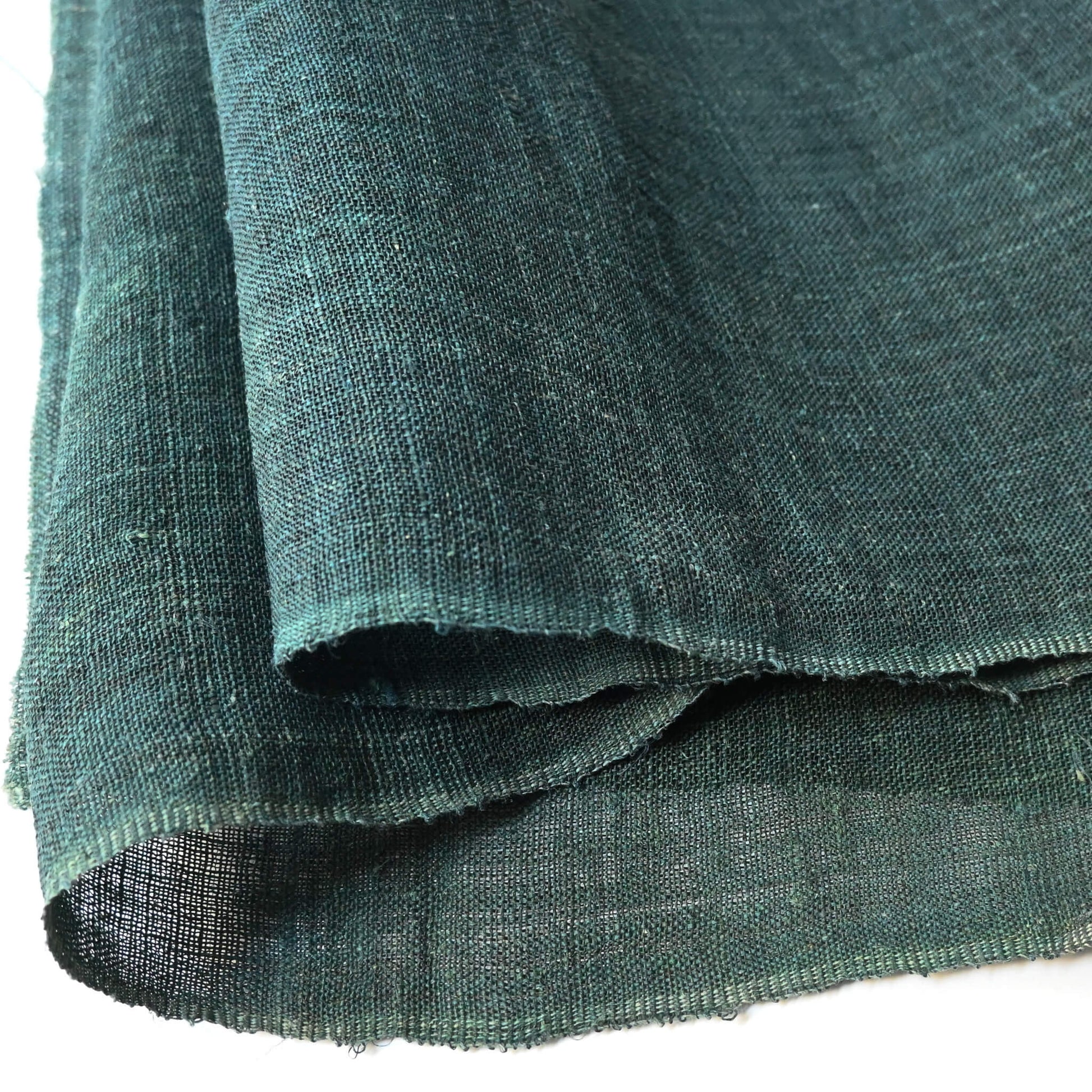 Close-up view of antique indigo green mosquito net kaya hemp panel.