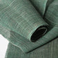 Close-up view of antique indigo green hemp, indigo with yellow dye, open weave and coarse feel.
