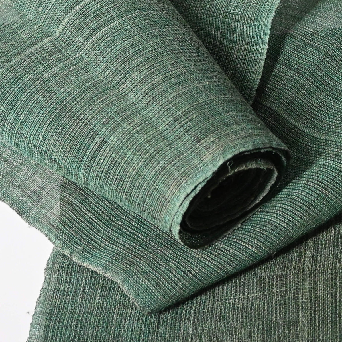 Close-up view of antique indigo green hemp, indigo with yellow dye, open weave and coarse feel.
