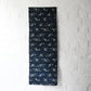 Full view of antique Japanese indigo kasuri cotton with unique motif with a mend.