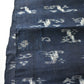 Detailed view of antique Japanese indigo kasuri cotton with unique motif with a mend.