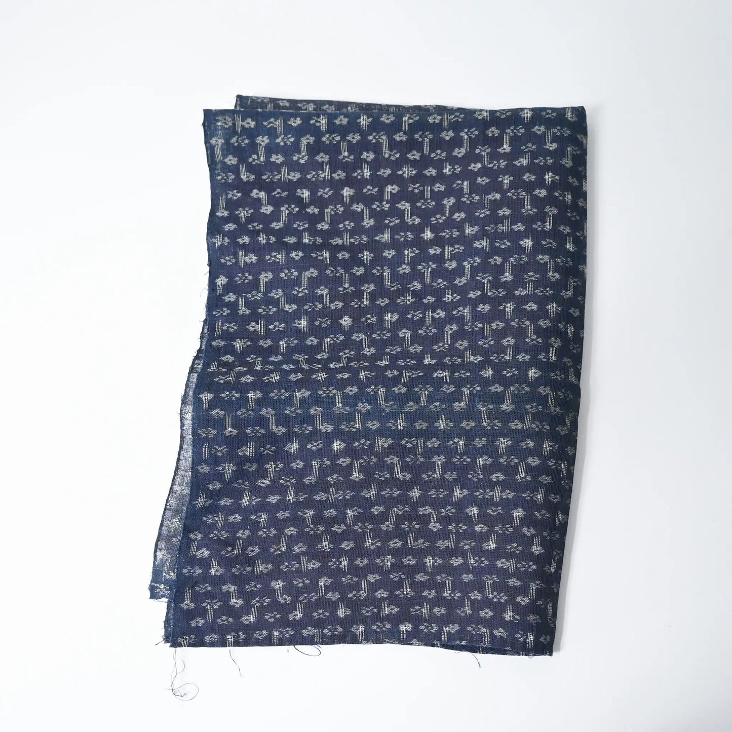 Antique indigo Kasuri hemp with intricate floral pattern, originally an apron.