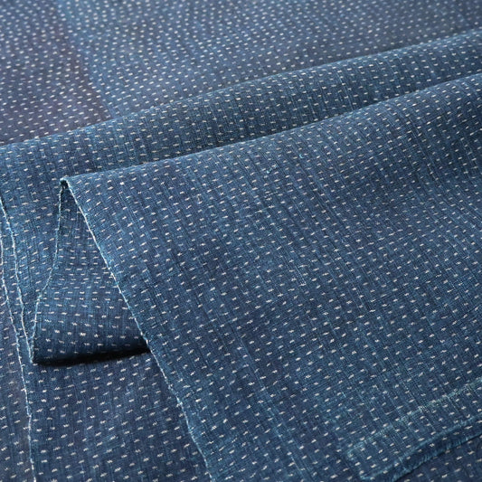 Close-up view of antique indigo kasuri hemp fabric piece from undone kimono, early 20th century.